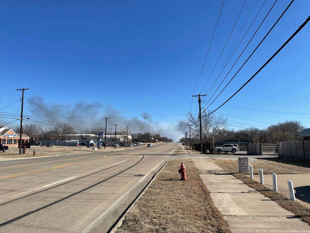 Emergency crews were on the scene of a large grass fire Tuesday afternoon, Feb. 15, 2022, near Kennedale in southeast Tarrant County. The fire was reported near Kennedale Parkway.