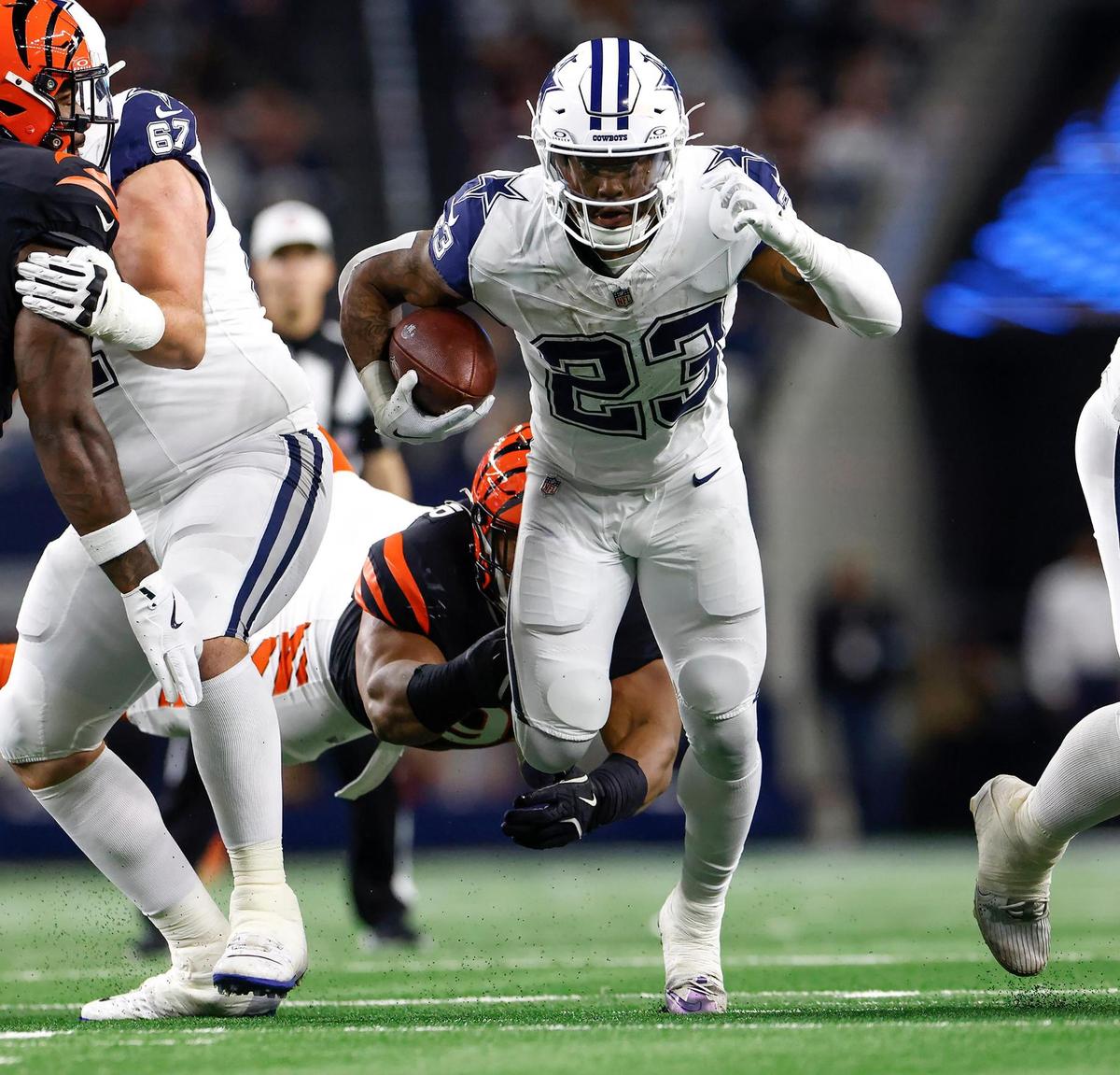 Dallas Cowboys running back Rico Dowdle runs the ball against the Cincinnati Bengals on Monday, Dec. 9, 2024, at AT&T Stadium in Arlington.