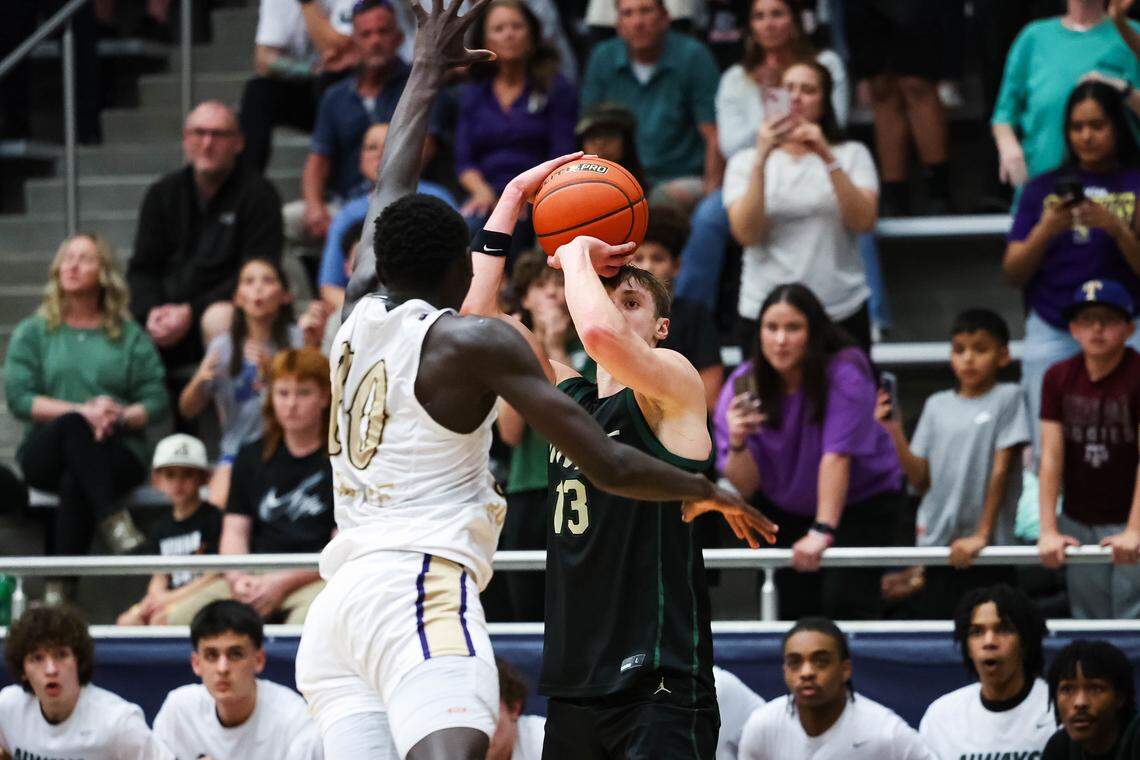 Birdville guard Avery Webb (13) lines up the game-winning three pointer over Denton’s Lojok Loliwa (10) in a UIL Class 5A Division I regional final at Flower Mound High School in Flower Mound, Texas, Friday, March 6, 2026.