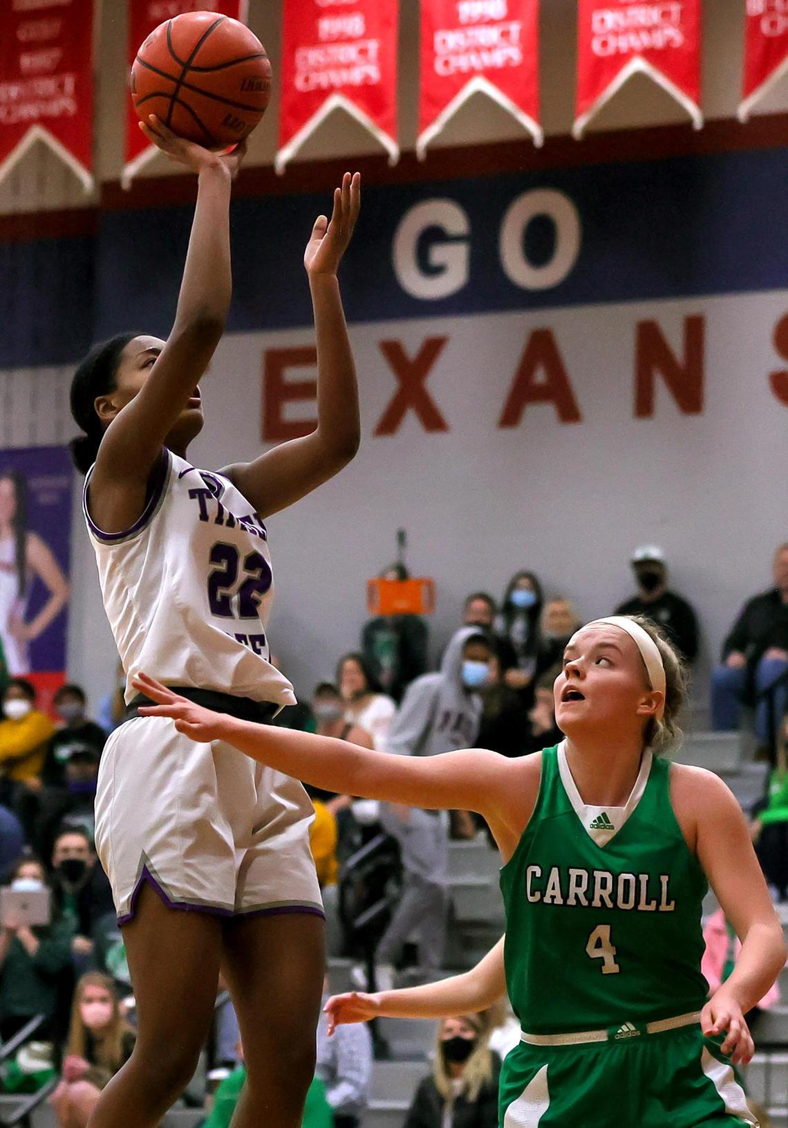 Keller Timber Creek forward Deja Lumsden (22) attempts a shot against Southlake Carroll guard Brittney Flexer (4) during the first half of a 6A Region I Regional Quarter-Finals Girls Basketball playoff game played on Thursday, February 25, 2021 at Justin Northwest High School. (Steve Nurenberg Special to the Star-Telegram)