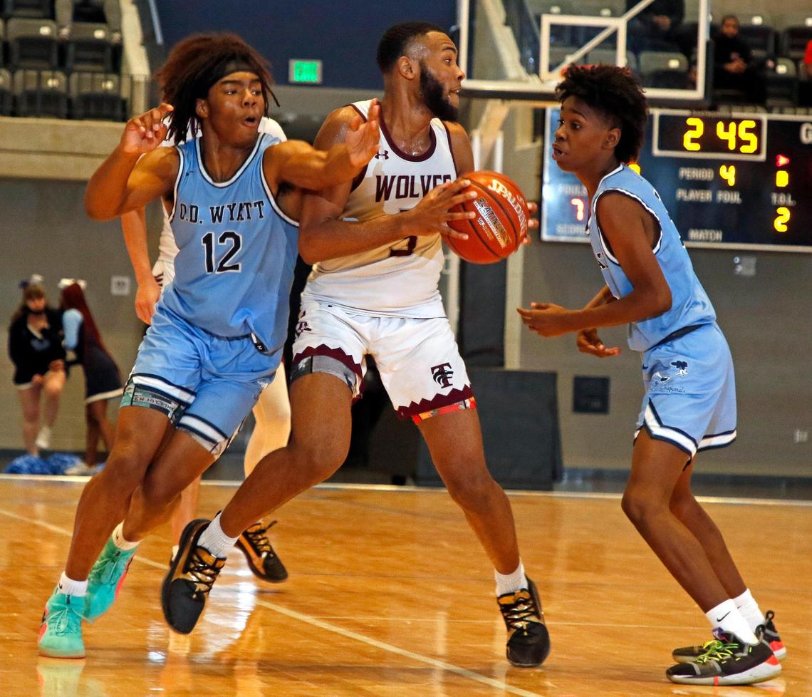 Wyatt guards Quest Madkins (12) and Julian Willis (5) double team Timberview guard Jared Washington (5) during the second half of a Division 5A Region 1 quarterfinal basketball game at Arlington ISD Athletics Complex in Arlington, Texas, Saturday, Feb. 27, 2021. Timberview defeated O.D. Wyatt 57-55. (Special to the Star-Telegram Bob Booth)