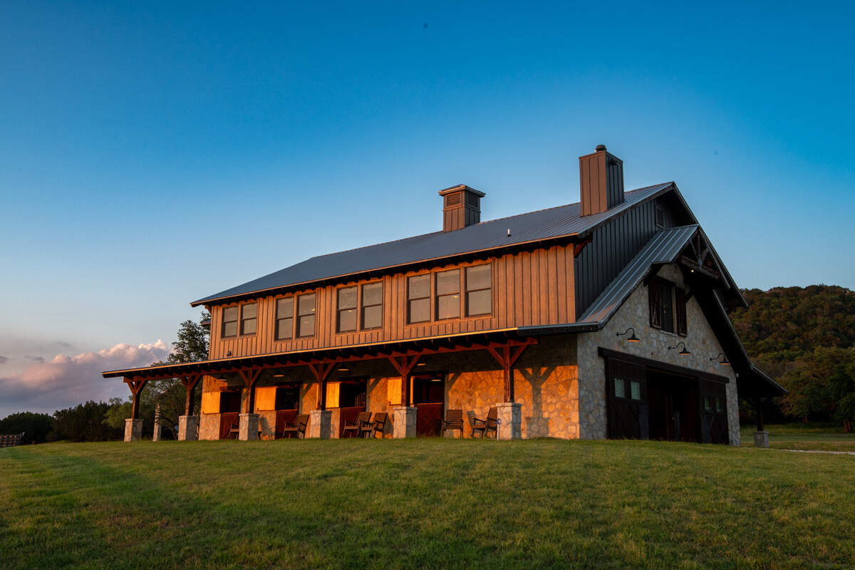 The equestrian barn at Bosque Mountain Ranch not only houses horses but also has 3,550 square feet of a living and entertaining area on the second floor.