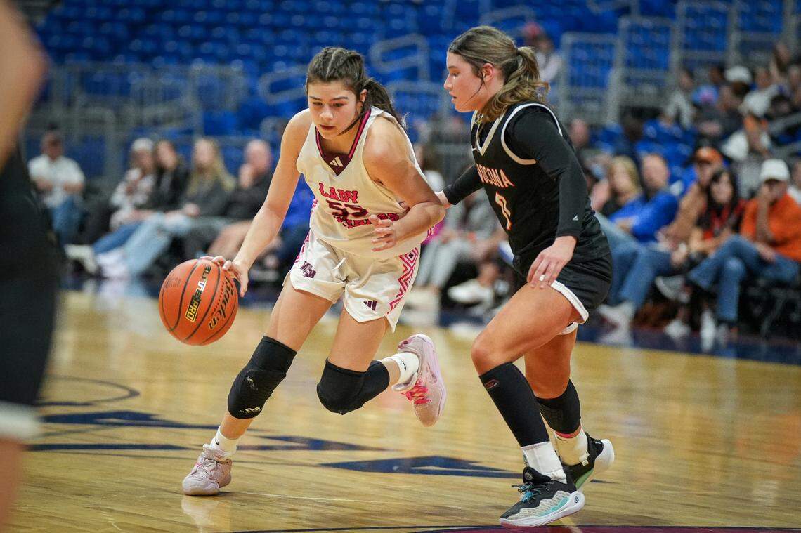 Martin’s Mill guard Kara Nixon (55), the Championship Game MVP, drives around Nocona’s Megyn Meekins (0) in the Class 2A state championship game on Saturday, March 3, 2024 at the Alamodome in San Antonio, Texas. Martin’s Mill defeated Nocona 44-42.