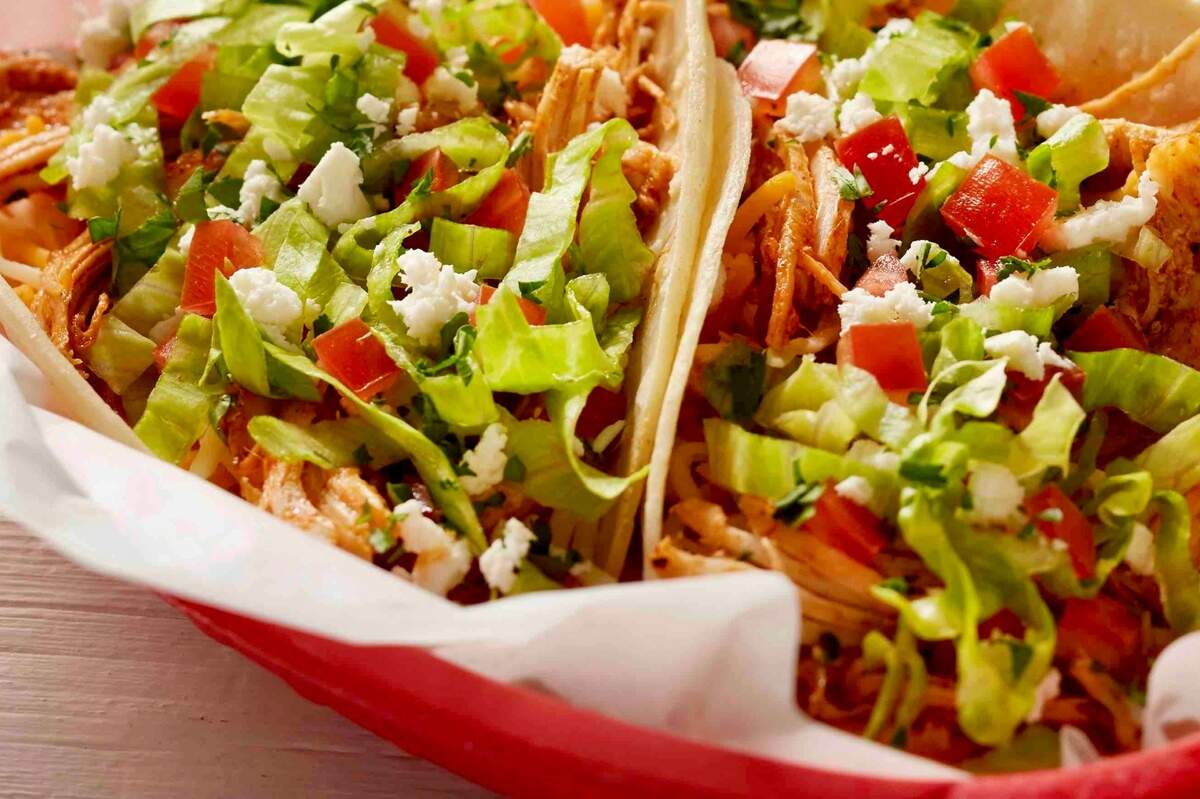 A Baja shredded chicken taco at Fuzzy’s Taco Shop, a longtime promoter of National Taco Day.