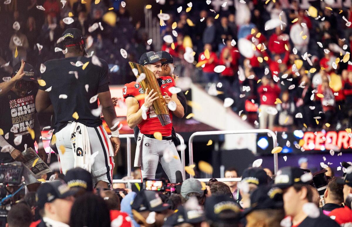 The Georgia Bulldogs, including quarterback Stetson Bennett, celebrate their 65-7 win over the TCU Horn Frogs at the 2023 College Football Playoff National Championship on Monday, January 9, 2023, at SoFi Stadium in Inglewood, Calif.