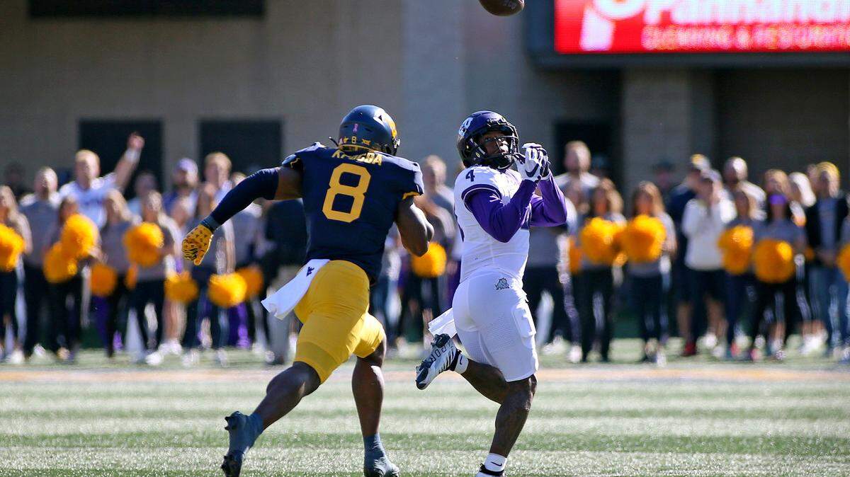 TCU wide receiver Taye Barber (4) catches a pass for a touchdown in the Horned Frogs’ win at West Virginia on Saturday, Oct. 29.