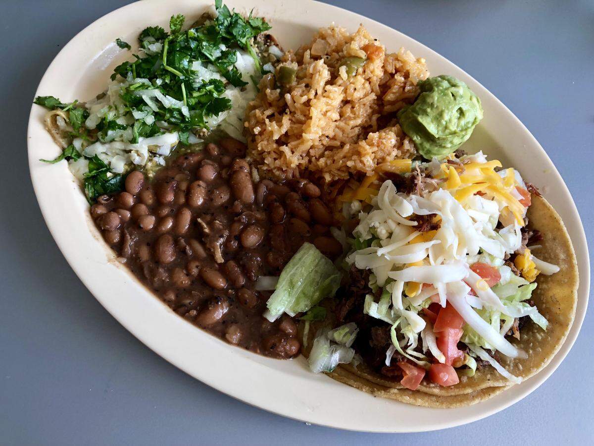 A brisket taco and a “street” chicken enchilada at Enchiladas Ole.