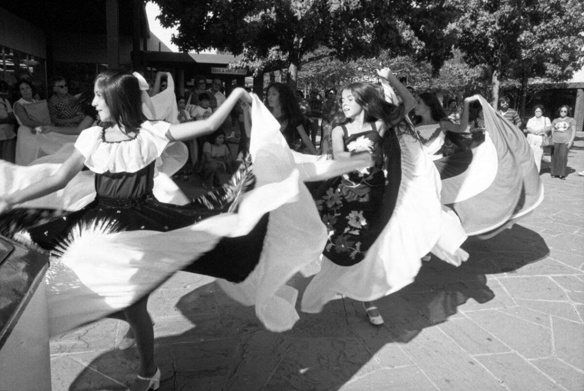Sept. 17, 1977: A group of young girls perform traditional Mexican dance as part of the Mexican Independence Day celebration at Seminary South Mall in Fort Worth.