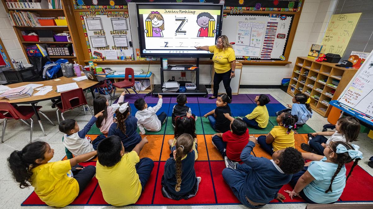 Kindergarten teacher Luz Botello teaches the pronunciations of letters to her class at Annie Webb Blanton Elementary School in Dallas on Oct. 22, 2024.