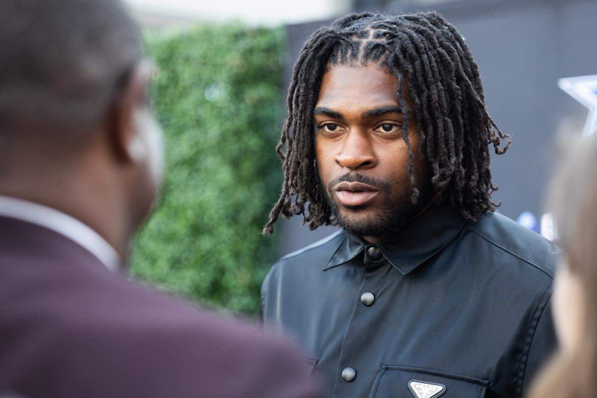 Dallas Cowboys Trevon Diggs talks with reporters on the blue carpet for the season kickoff event Thursday, Aug. 25, 2022, at Ford Center in Frisco.