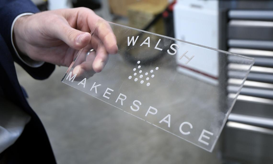 Tony Ruggeri, Co-CEO RPG, holds an laser etching made in the new "MakerSpace" building at the Walsh development in Fort Worth, TX, Tuesday, March 27, 2018.