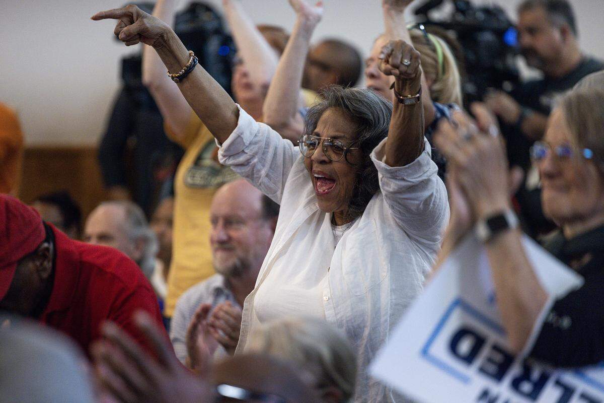 Rally attendees react to Tarrant County Commissioner Roderick Miles speaking during the “Build The Backlash” rally at greater St. Stephen First Church in Fort Worth on Wednesday, Aug. 6, 2024. The rally called out the efforts of Texas republicans to gerrymander the state and silence Black voters.