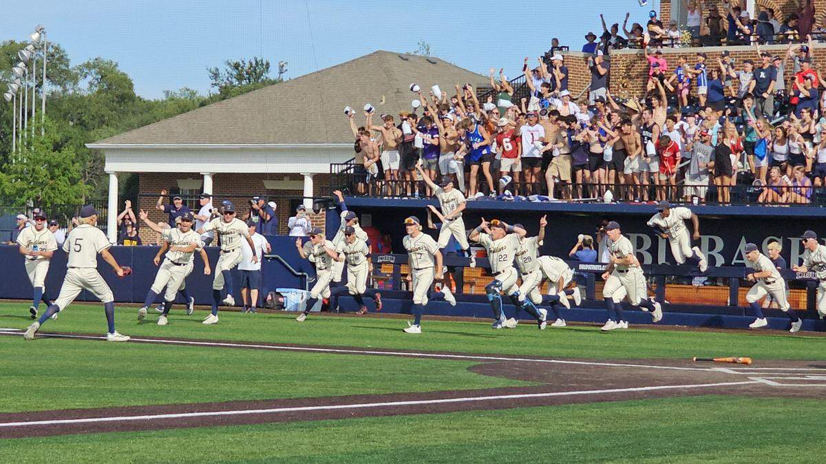 The Keller bench rushes out to meet relief pitcher Gerad Tucker (5) after getting the final out to win Game 3 against Rockwall in their Class 6A Division I state semifinal series on Saturday, May 30, 2026, at Horner Ballpark on the campus of Dallas Baptist University in Dallas, Texas.