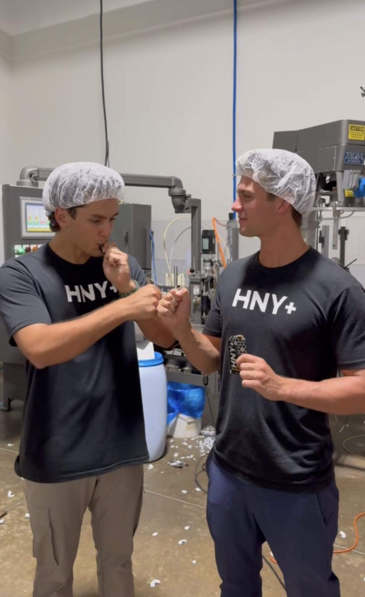Liam Brogan (left) and Ross Cooley (right) trying out the HNY+ honey from the Yucatan Peninsula in their manufacturing facility in Chicago.