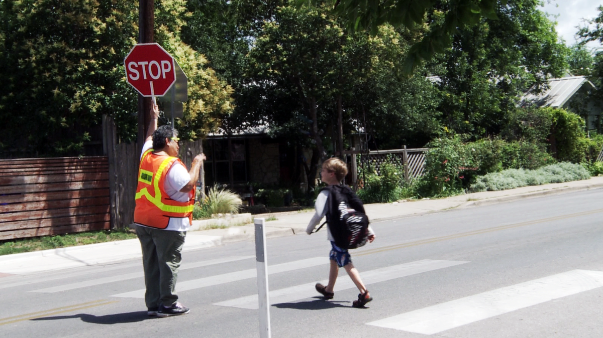 School zones are put in place to allow children to safely cross the street.