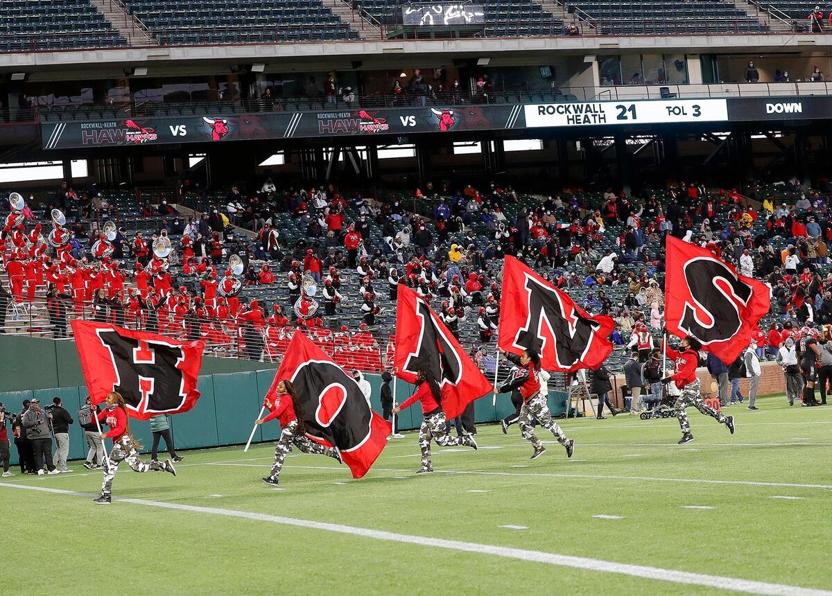 The Cedar Hill spirit crew celebrate a touchdown during the 6A division 2 quarterfinals at Globe Life Park in Arlington, Texas, Saturday, Jan. 02, 2021. With the game tied 21 after regulation Cedar Hill defeated Rockwall Heath 27-24. (Special to the Star-Telegram Bob Booth)