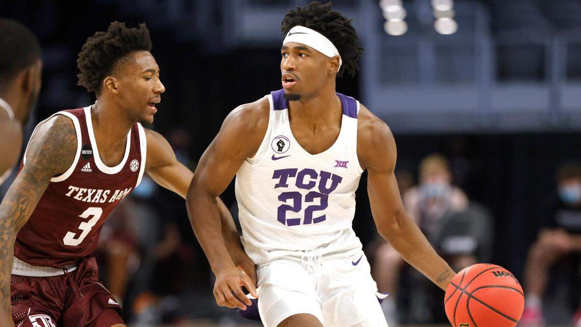 TCU guard RJ Nembhard brings the ball up court against Texas A&M guard Quenton Jackson during the second half of TCU’s victory on Saturday, Dec. 12, 2020, in Fort Worth.