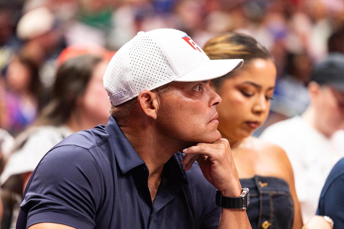 Former Texas Rangers catcher Pudge Rodriguez sits court side during the first half of a WNBA game between the Dallas Wings and Indiana Fever at the American Airlines Center in Dallas on Friday, June 27, 2025.