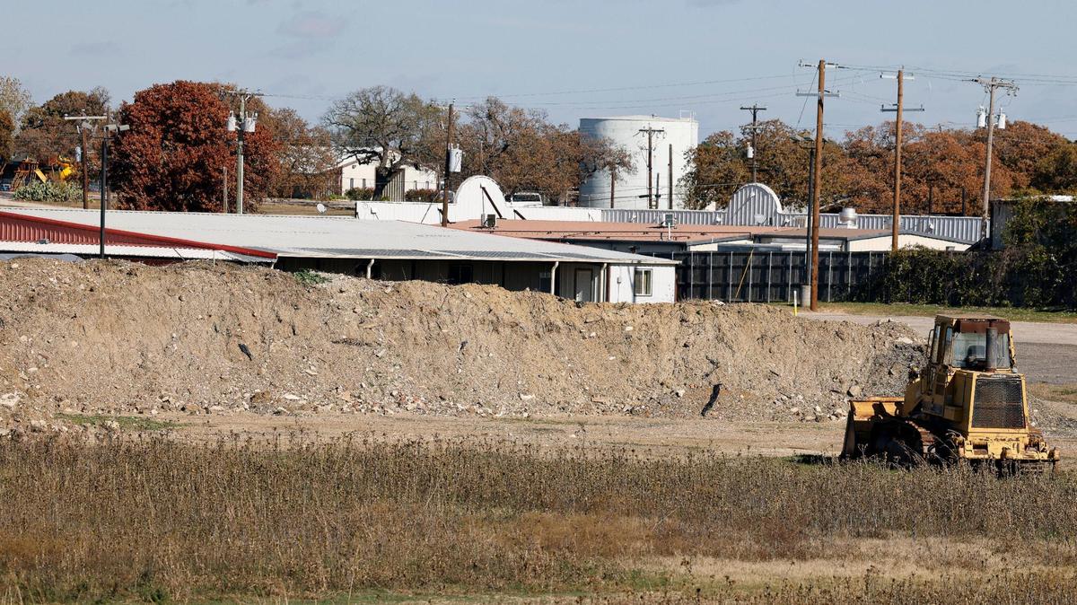 A pile of landfill sits on the property of a proposed batch concrete plant in Burleson, Texas, Friday, Dec. 08, 2023. The property which once housed a pond has been filled with landfill. It has also had several feet of sand removed from the area. Smith and his neighbors oppose the plant being built within about 200 yards of their backyards. (Special to the Star-Telegram Bob Booth)