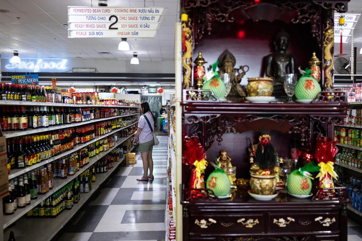 A customer shops in the sauce aisle of Nguyen Loi Oriental Supermarket in Haltom City.