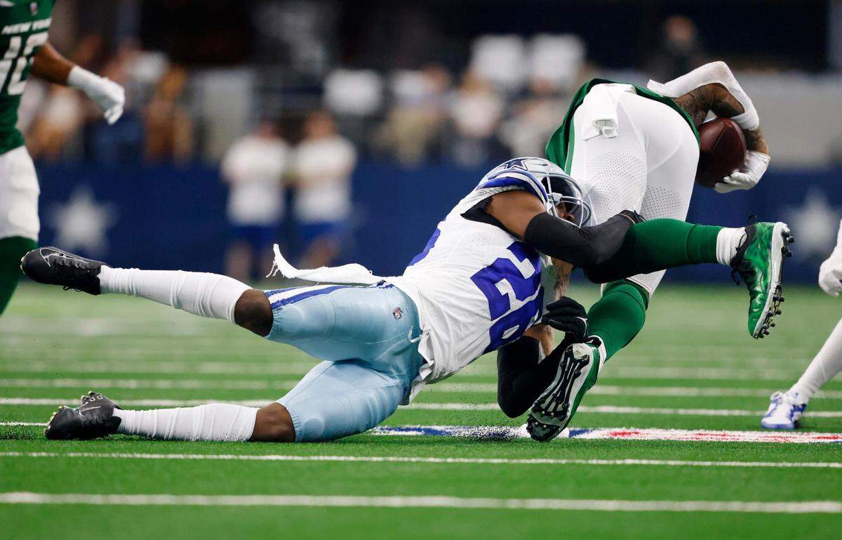 Dallas Cowboys’ DaRon Bland tackles New York Jets tight end Tyler Conklin on Sunday, September 17, 2023, at AT&T Stadium in Arlington.