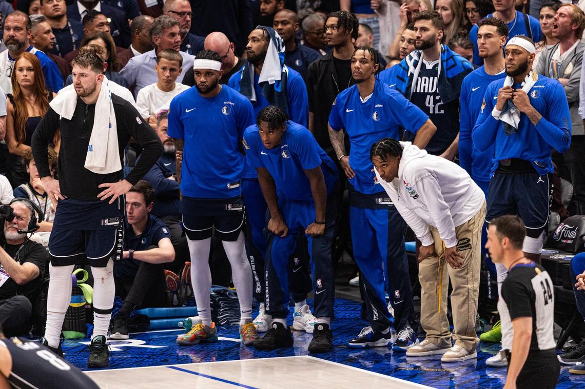 The Dallas Mavericks bench reacts after the game falls out of reach late in the fourth quarter of game 3 of the 2024 NBA Finals at American Airlines Center in Dallas on Wednesday, June 12, 2024.