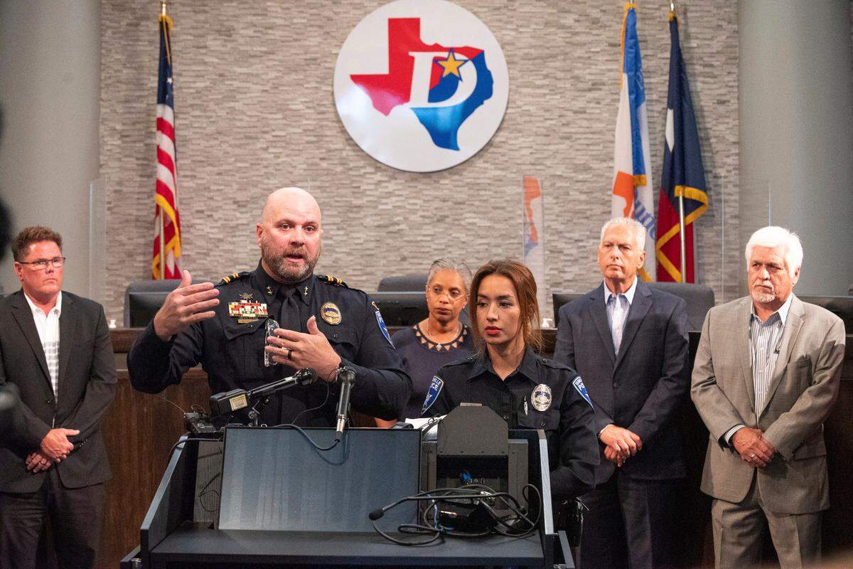 Duncanville Assistant Chief of Police Matthew Stogner, left, and Duncanville Crime Prevention Specialist Michelle Arias, right, conduct a press conference about an incident where Duncanville police officers shot and killed an armed man at a children’s summer camp, on Monday, June 13, 2022 in Duncanville, Texas. 