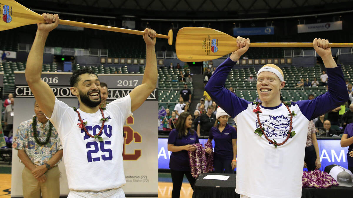 TCU guards Alex Robinson (25) and Jaylen Fisher (10) hold trophies after TCU defeated Indiana State 83-69 in an NCAA college basketball game to win the Diamond Head Classic, Tuesday, Dec. 25, 2018, in Honolulu. Robinson was named tournament MVP and Fisher won an award for making the all tournament team. (AP Photo/Marco Garcia)