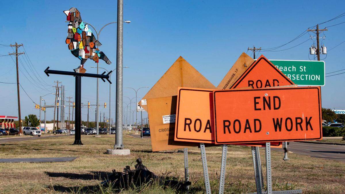 Public art installations made from recycled material from Alabama-based sculptor Christopher Fennell towers over the roads in far north Fort Worth on Friday. Planning for the North Beach Street project to install art across the neighborhood began in 2006.