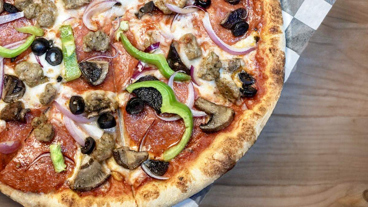 A supreme pizza at Rex’s Bar & Grill.