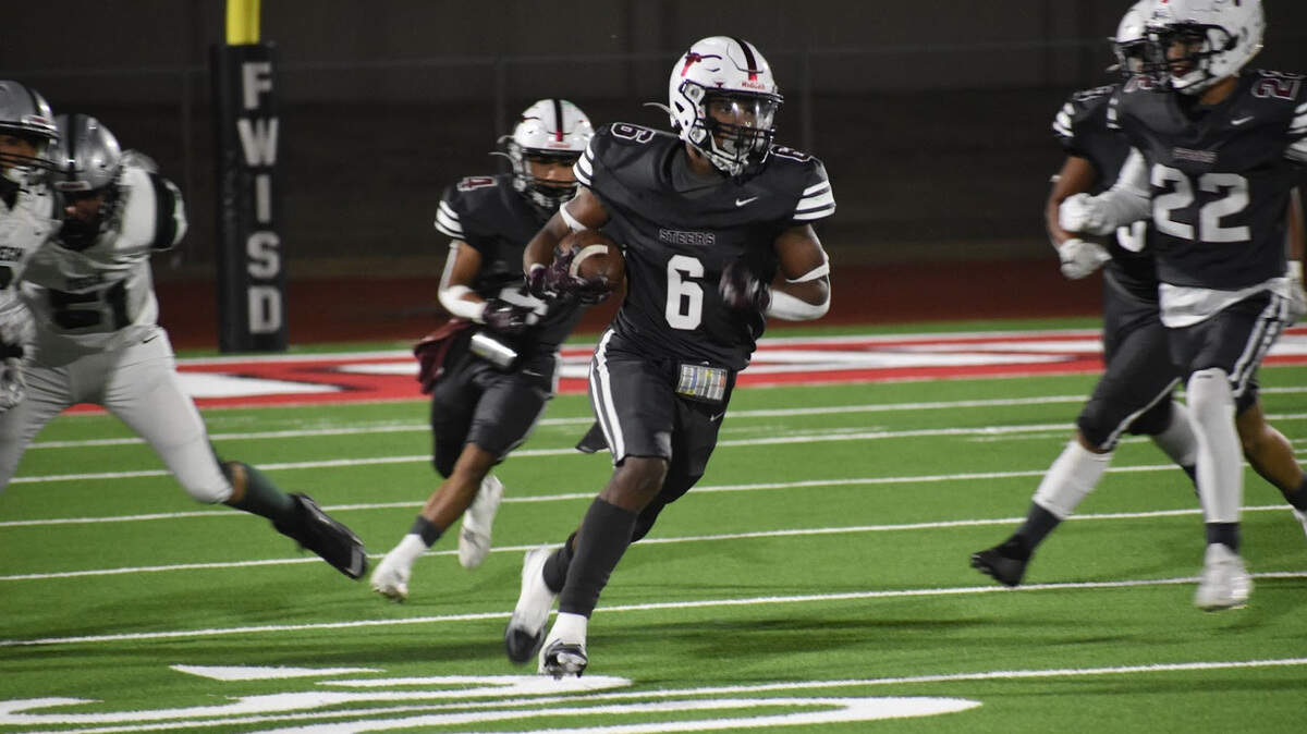 Northside’s Brandon Forrest (6) carrying the ball during a high school football game against Fort Worth Trimble Tech High School at Clark Stadium in Fort Worth, Texas, Thursday, Oct. 14, 2022. Northside won 44-7. (Nang (Sofia) Oo/Special to the Star-Telegram)