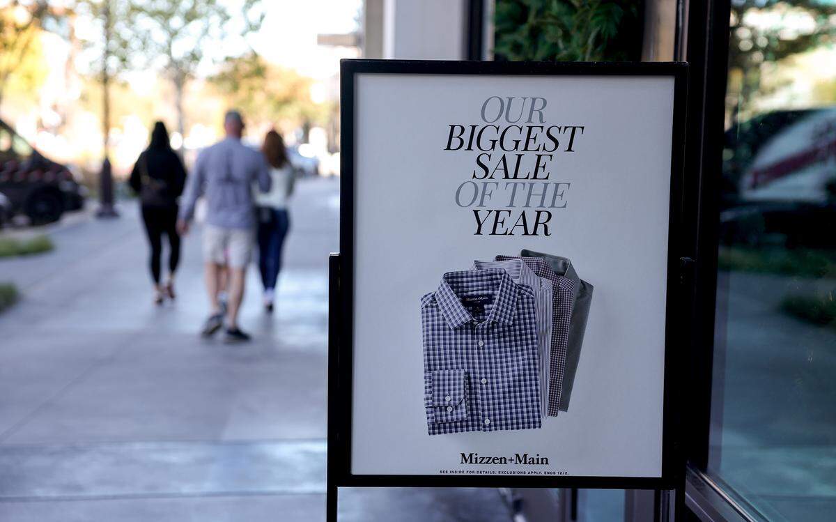 Signs advertise holiday season sales at The Shops at Clearfork on Tuesday, Nov. 25, 2025, in Fort Worth.