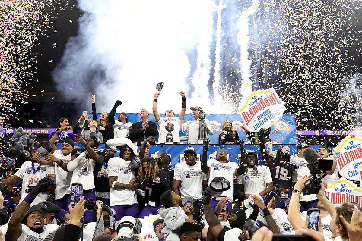 SAN ANTONIO, TEXAS - DECEMBER 30: The TCU Horned Frogs celebrate during the post game ceremony after defeating the USC Trojans in the game at the Alamodome on December 30, 2025 in San Antonio, Texas. (Photo by Kenneth Richmond/Getty Images)