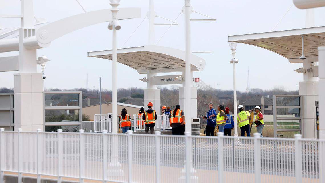 A crew works to prepare the new Trinity Lakes Station for operation on Friday, February 16, 2024. The station, which opened on Feb. 19, is a new stop on the Trinity Railway Express commuter rail between Dallas and Fort Worth.