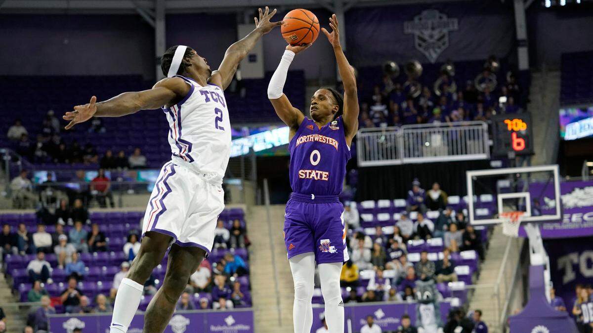 Northwestern State guard Demarcus Sharp (0) shoots against TCU forward Emanuel Miller (2) during the first half of an NCAA college basketball game in Fort Worth, Texas, Monday, Nov. 14, 2022. (AP Photo/LM Otero)