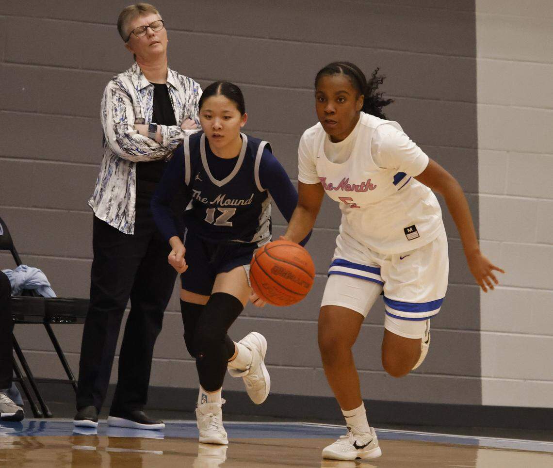 North Crowley guard Kori Singleton (5) races down court ahead of Flower Mound guard Emily Tran (12) during the second half of a UIL Class 6A Division I girls regional final basketball playoff game at Arlington ISD Athletics Center in Arlington, Texas, Friday Feb. 27, 2026.