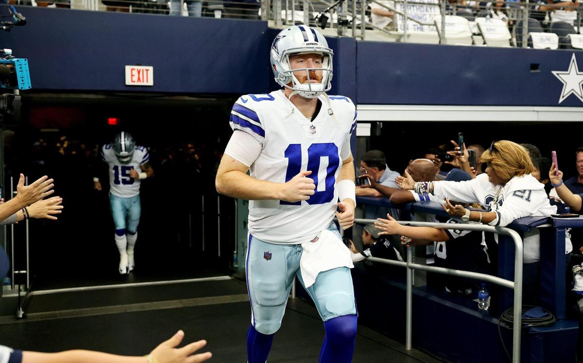Dallas Cowboys quarterback Cooper Rush takes the field to warm up against the Washington Commanders on Sunday, October 2, 2022, at AT&T Stadium in Arlington.