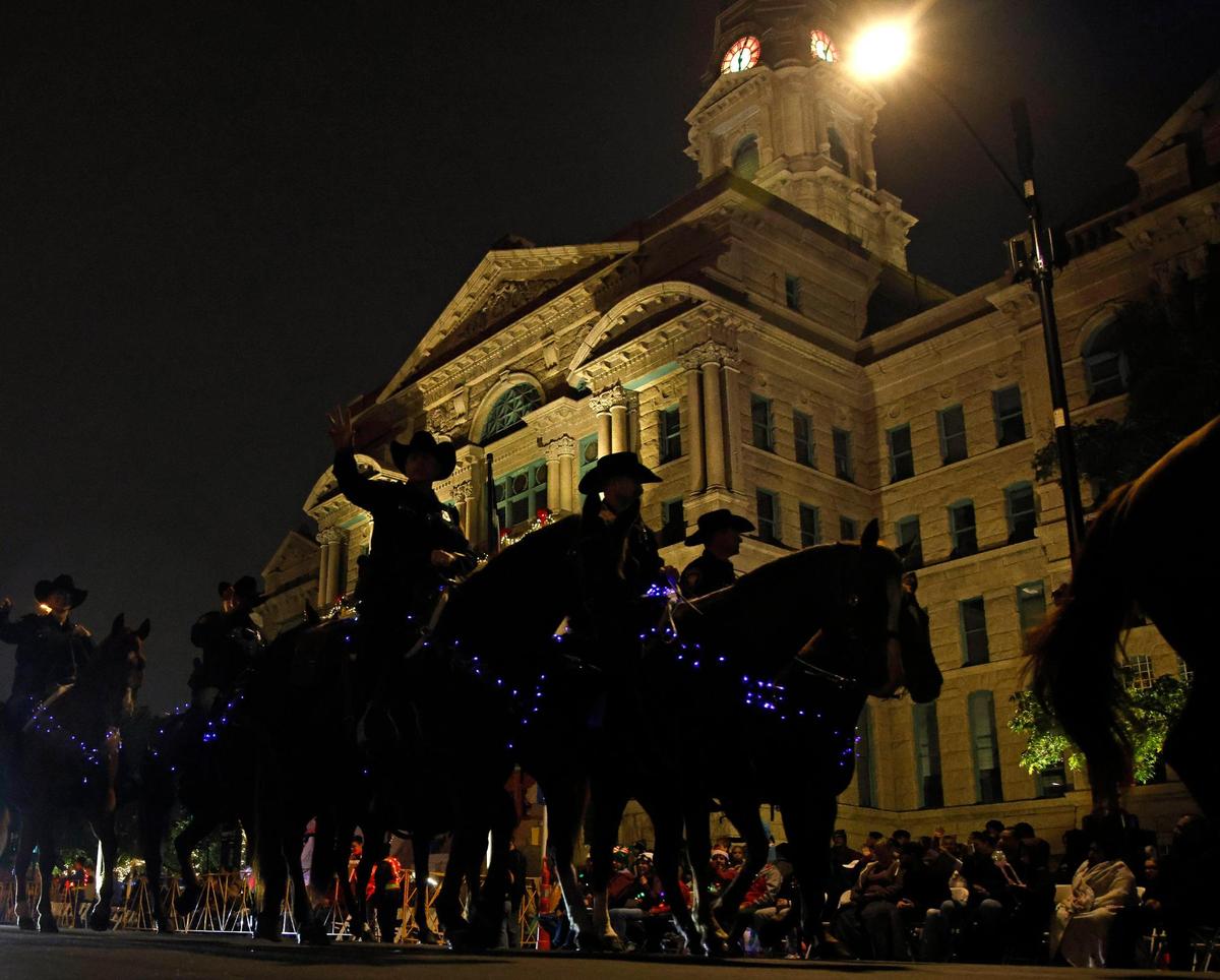 Fort Worth Police Mounted Patrol passes by the Tarrant County Courthouse.