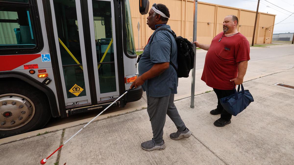 Marcus Johnson, left, and Billy Patton board a Trinity Metro bus heading towards Fort Worth Central Station to begin their journey home after a day of working at Lighthouse for the Blind in May. Many Fort Worth residents with visual impairments rely on limited public transit options to get around town.