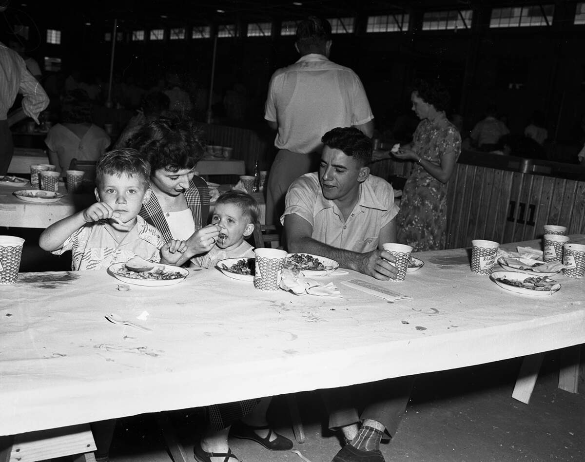 Sept. 5, 1950: During Labor Day activities, one of the many families that attended the picnic are shown sitting together. Mr. and Mrs. William M. Morris of Arlington sit with their children, Bill Jr., 5, and Barbara, 2.