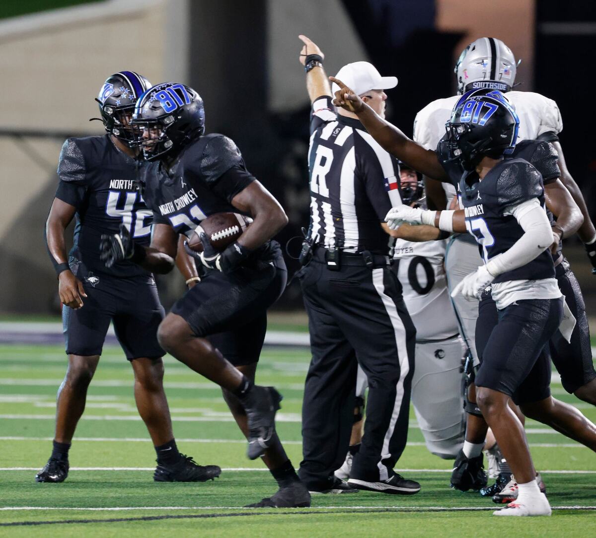 North Crowley defensive lineman Xavier Coleman (21) emerges out of the pack with his fumble recovery during a UIL football game at Crowley ISD Sports Complex in Fort Worth Friday, Sept. 13, 2024.