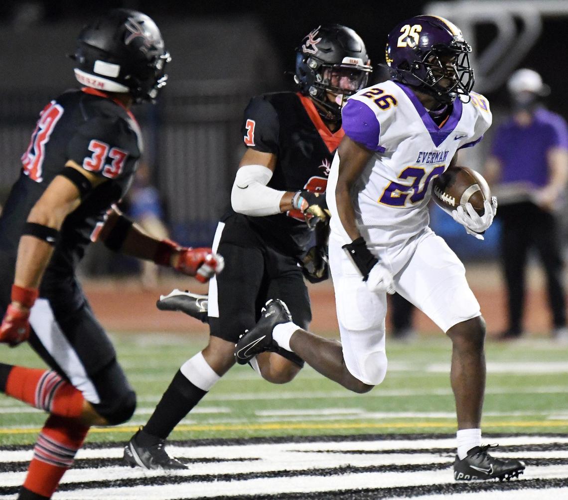 Burleson’s Drue Saenz, left and Quintion Ivory chase Everman’s Jonathen Wilson as he races into the backfield for a first down in the second quarter of their Division 2 District 5-5A football game Thursday, November12, 2020 at Burleson ISD Stadium in Burleson, Texas. Special/Bob Haynes