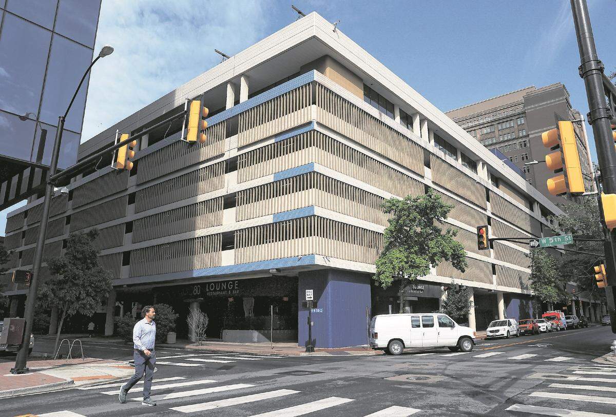 Dickies relocated its headquarters in summer 2023 from West Vickery Boulevard to the top floor of this building on Taylor Street that is part of The Tower complex in downtown​ Fort Worth. A pedestrian walks past the building on April 16, 2024.