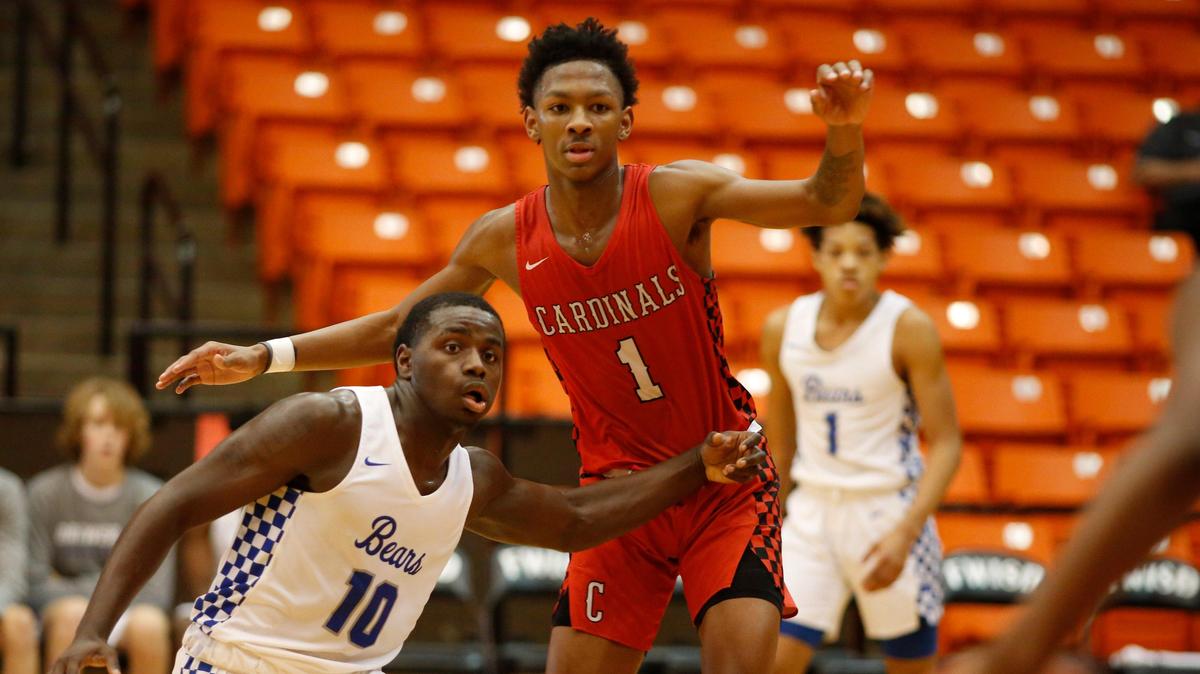 Brewer’s Devin Avant (10) challenges MacArthur’s Trae Mathis (1) for position. Irving MacArthur boys played Brewer in the 8th Annual DFW Challenge High School Basketball Showcase at Wilkerson-Greines Athletic Complex in Fort Worth Saturday, December 14, 2019.