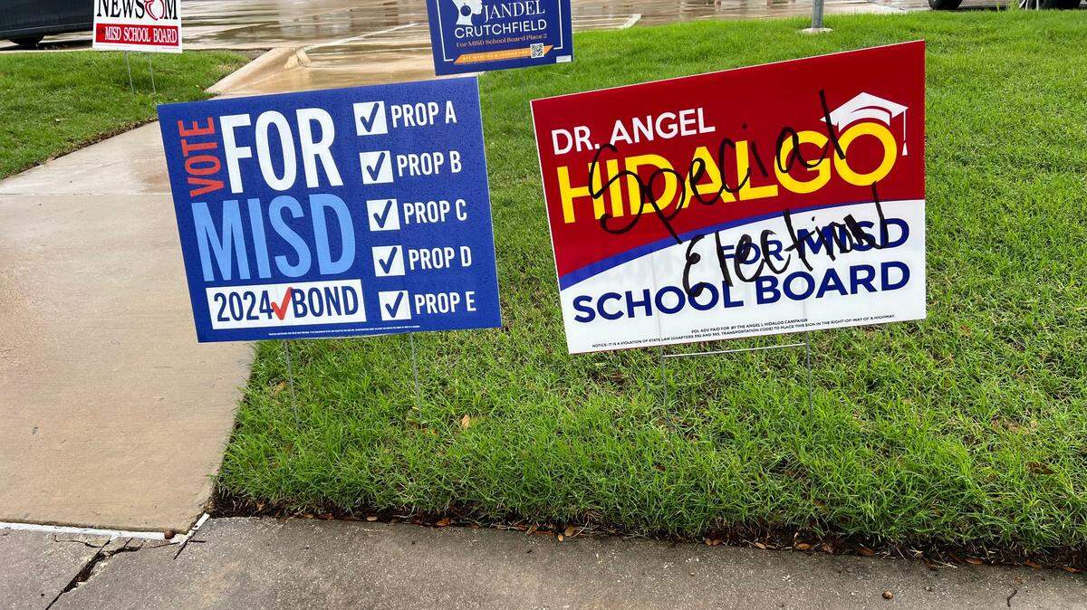 A campaign sign for Angel Hidalgo a candidate for place 2 with “special election” scribbled on it.