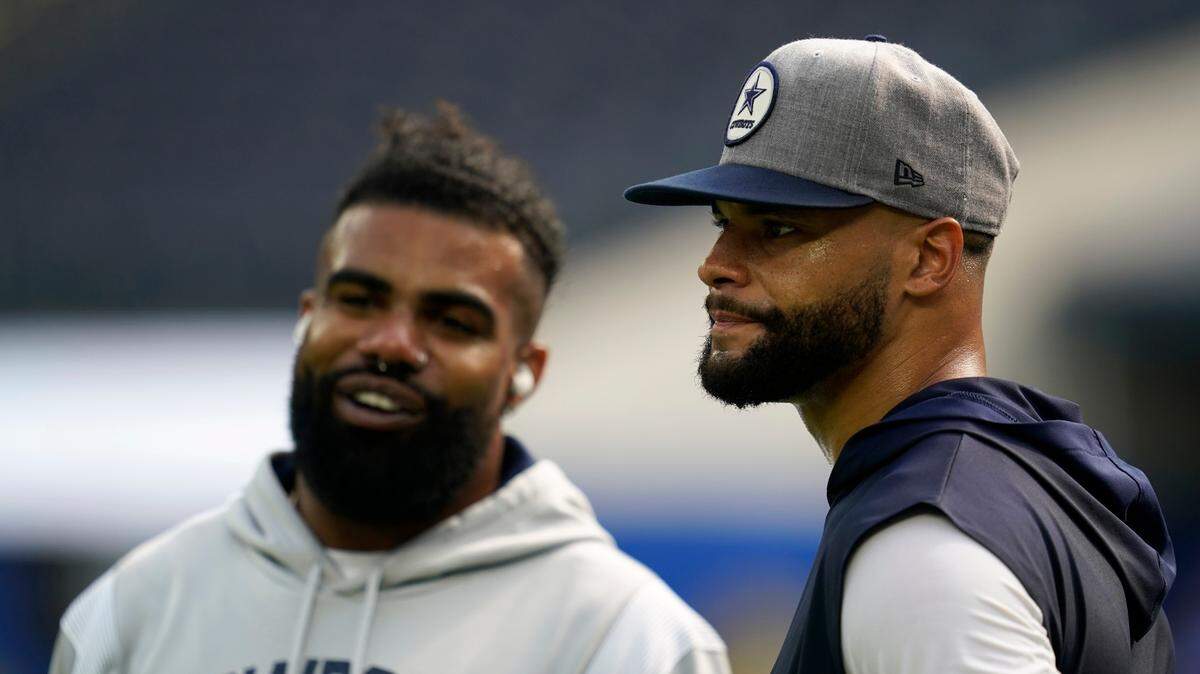 The NFL will not fine Dallas Cowboys’ Ezekiel Elliott, left, and quarterback Dak Prescott, right, for using expletives in two different media sessions this week.
