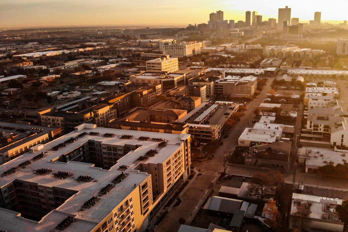 The sun sets on Crocket Row in the West 7th neighborhood of Fort Worth in February 2022.