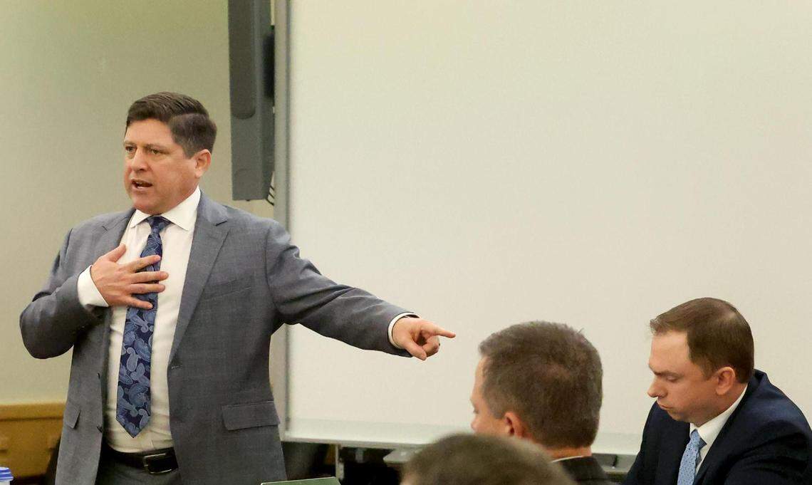 Assistant Tarrant County Criminal District Attorney Dale Smith, left, gives his closing argument during the trial of Aaron Dean, right, on Wednesday, December 14, 2022, in Fort Worth. Dean is accused of murder in the 2019 shooting of Atatiana Jefferson at her home.