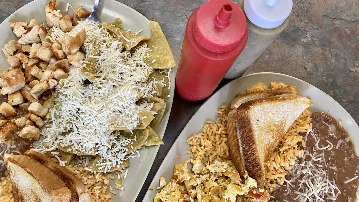 Migas Mexico-style, right, include grilled tomatoes, jalapenos and onions,. Chilaquiles verdes with chicken, left, were true to the Mexico original.