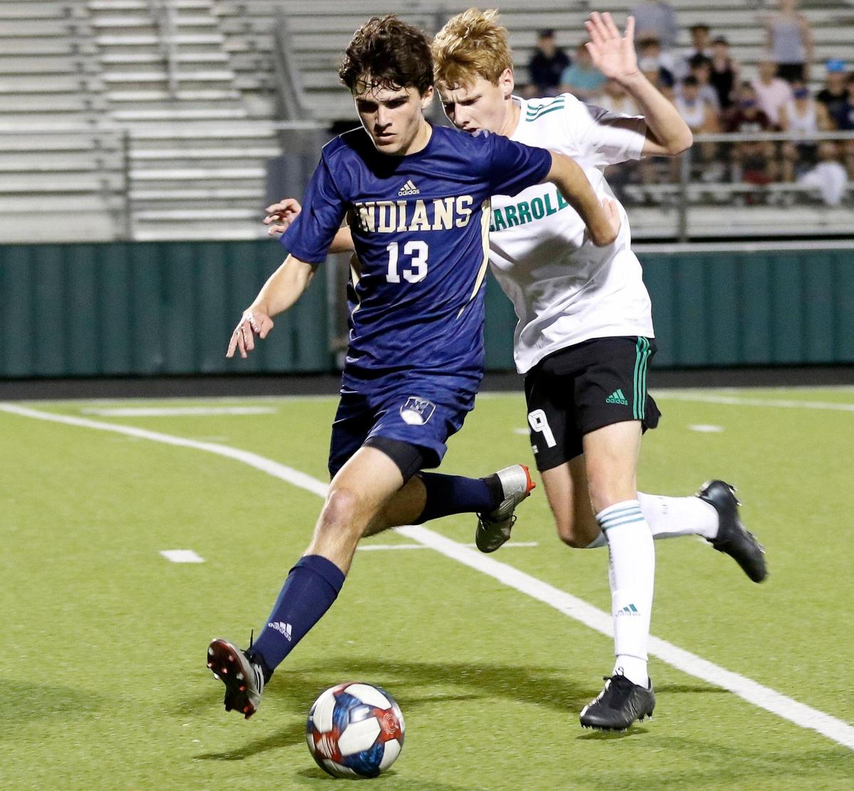 Keller’s Bryce Boneau and Carroll’s Drake Ferri attack the ball during a high school soccer game at Keller ISD Stadium in Keller, Texas, Monday, March 15, 2021. Carroll defeated Keller 2-1. (Special to the Star-Telegram Bob Booth)